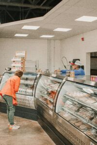 A customer browses fresh meat selection in a South Carolina butcher shop.